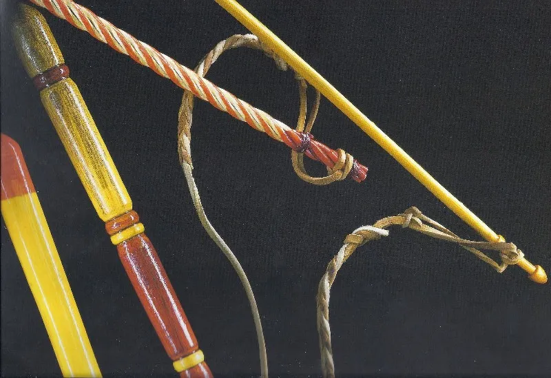 Whips with turned and painted handles and braided leather lashes